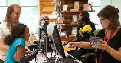 Patrons checking out DVDs