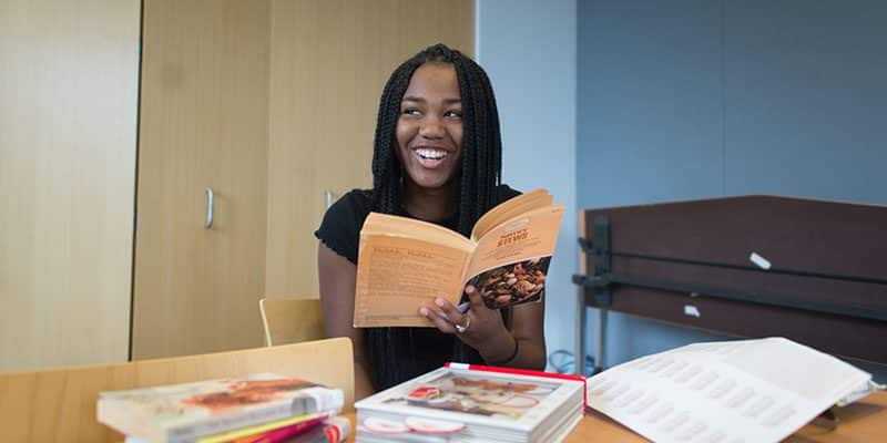 Teen holding a book
