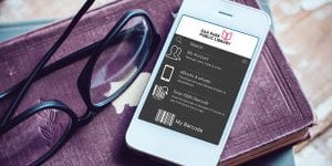 SWAN app on phone on stack of books