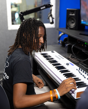 Nick Posey uses keyboard in Audio Booth