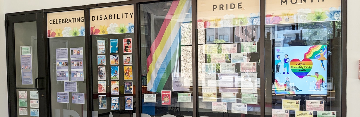 Display for Disability Pride Month in the windows of the Main Library Idea Box
