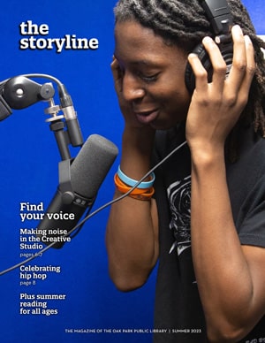 Cover of The Storyline magazine showing a person using a microphone